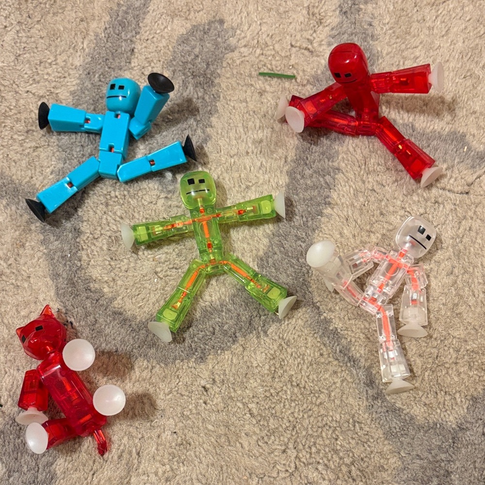 Colorful Suction-Cup Action Figures - Blue, Red, Green, Clear